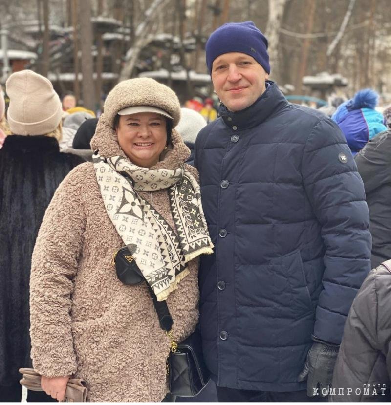 The same couple.  Olga Nikolaevna is wearing a Lou Vuitton scarf